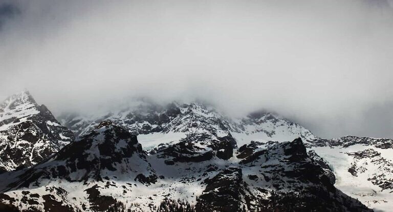 snow covered mountain during daytime