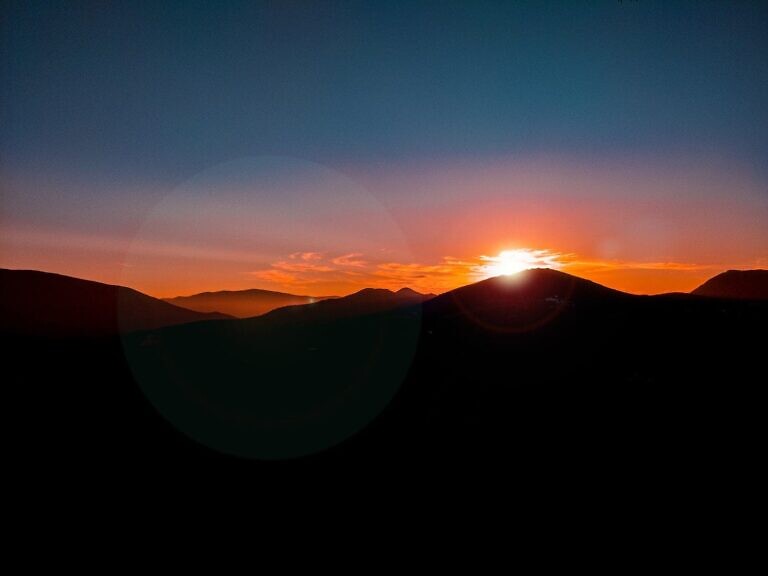 silhouette of mountain during sunset