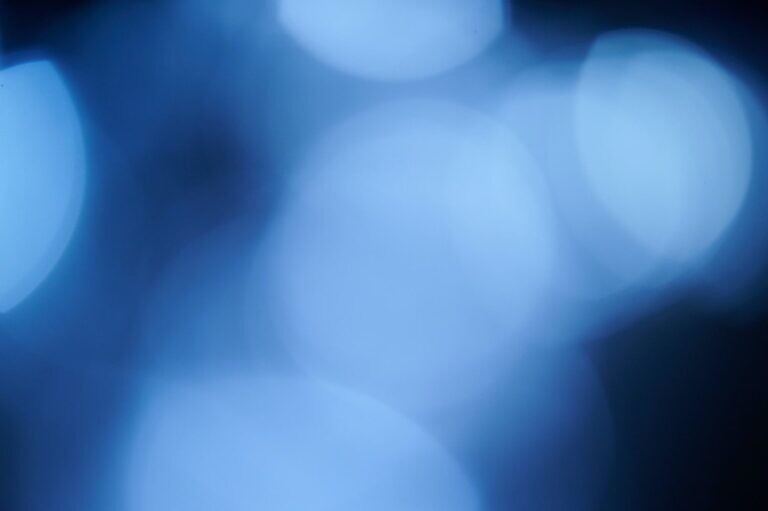 white and blue bokeh lights